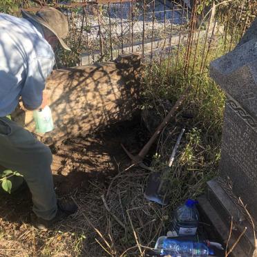 5. Struggling with the overturned gravestone of Eleanor Emma Elizabeth WRIGHT