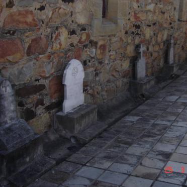 5. Old gravestones against the church wall